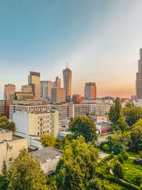 High angle view of trees and buildings against sky