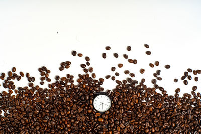Close-up of coffee beans against white background