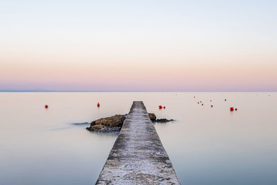 The pier towards the sea. the look towards the horizon.