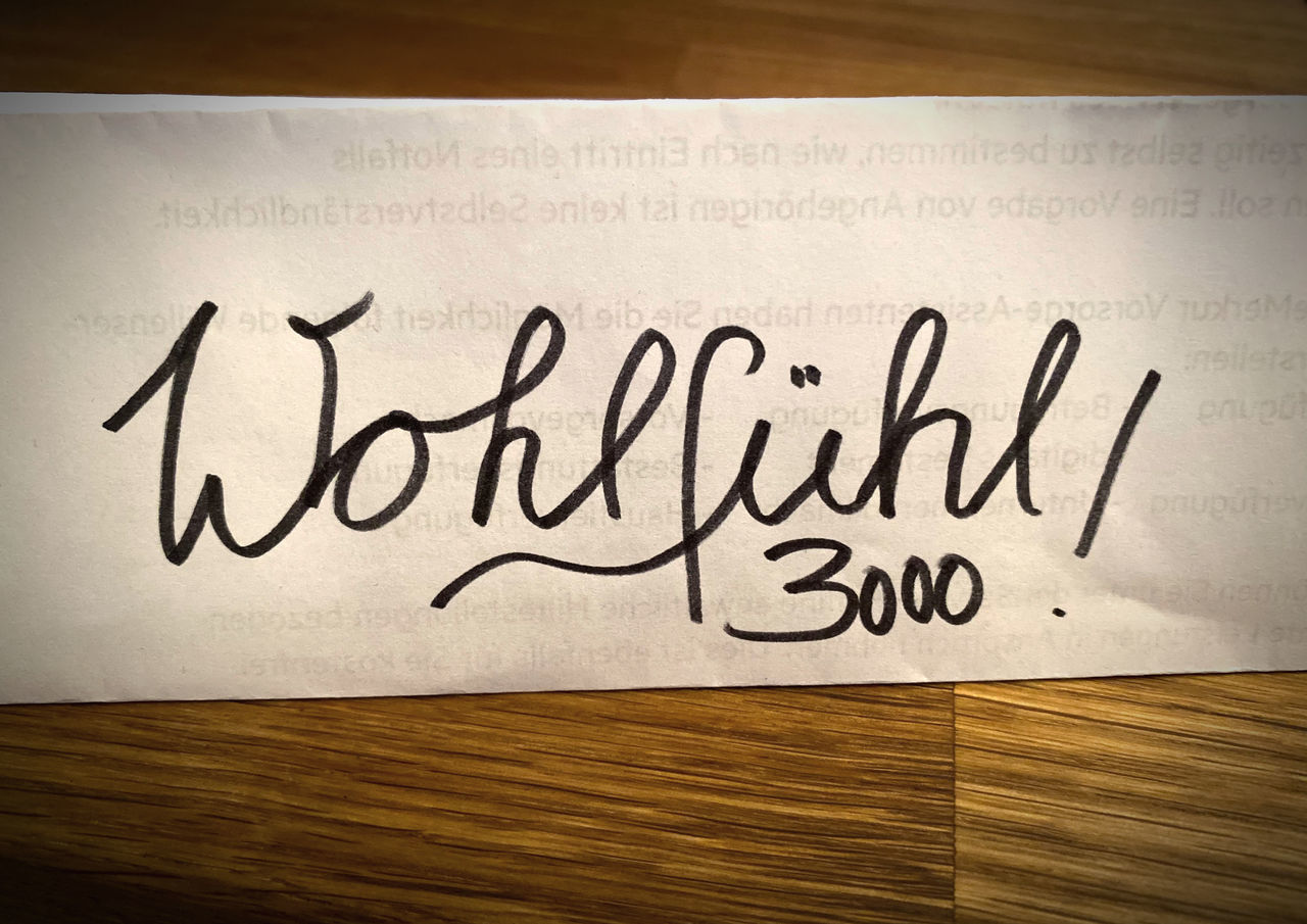 text, calligraphy, handwriting, font, communication, art, writing, indoors, western script, no people, gratitude, message, wood, positive emotion, number, paper, single word