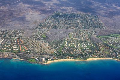 Aerial view of cityscape by sea