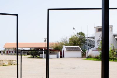 Building by street against clear sky