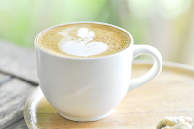 Close-up of cappuccino on table