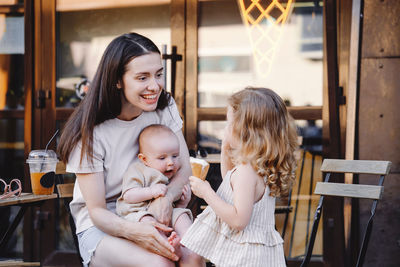 Portrait of mother and daughter at home