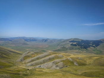 Scenic view of landscape against clear blue sky