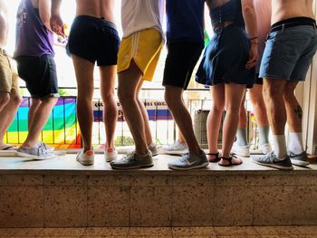 Low section of people standing on retaining wall