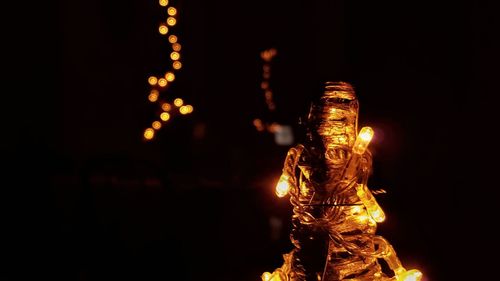 Illuminated statue at night