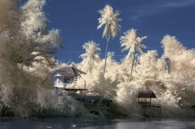 Panoramic shot of building by sea against sky