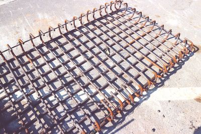 High angle view of chairs in city during sunny day