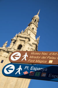 Low angle view of clock against clear blue sky