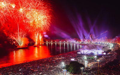 Low angle view of firework display at night