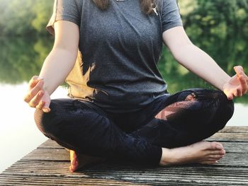 Low section of man sitting outdoors