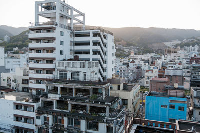 Buildings in city against sky