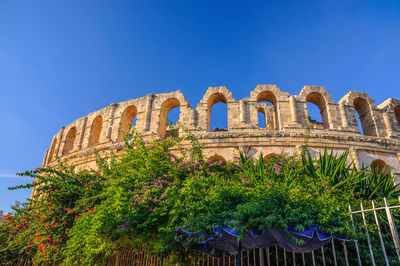 Low angle view of historical building against blue sky