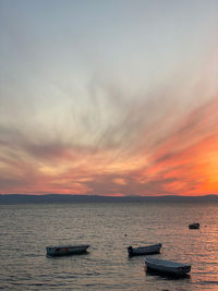 Colorful scenic view of sea against sky during sunset