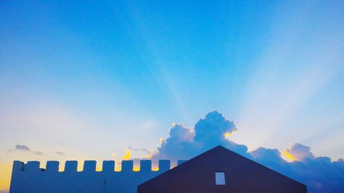 Low angle view of building against blue sky