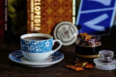 Tea ritual with a cup of herbal tea on a wooden table