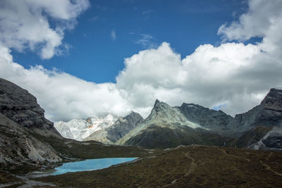 View of mountain range against cloudy sky