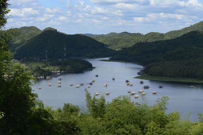 Scenic view of river in forest against sky