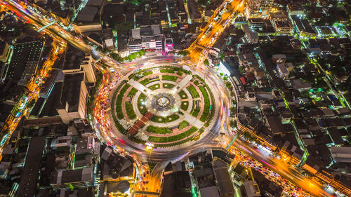 Aerial view of illuminated buildings in city at night