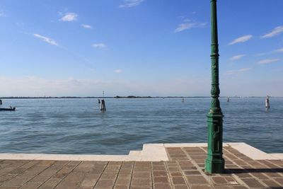 Scenic view of sea against blue sky