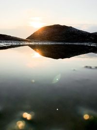 Scenic view of lake against sky during sunset