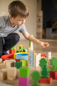 Boy playing with toys at home