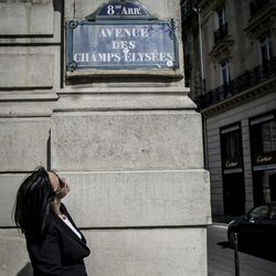 Woman standing against wall