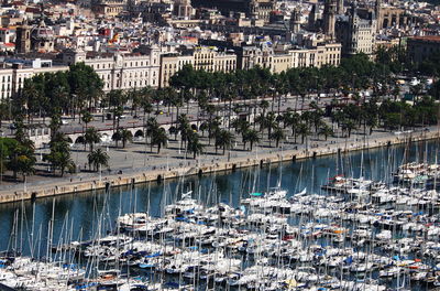 Aerial view of boats moored in city