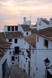 High angle view of buildings against sky during sunset