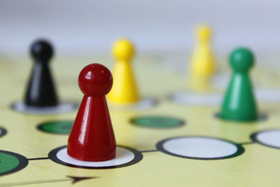 Close-up of game pieces on ludo