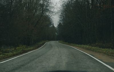 Empty road amidst trees