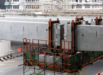 The guideway beam of the monorail project is under construction to overpass the street.