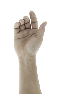 Close-up of human hand against white background