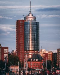 Modern buildings in city against sky