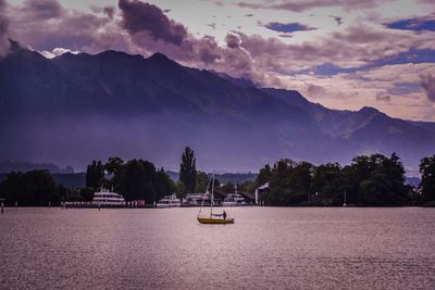 Scenic view of sea against cloudy sky