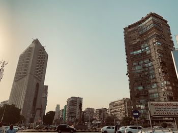 Modern buildings in city against clear sky