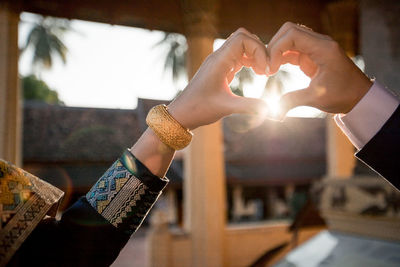 Close-up of hands holding heart shape