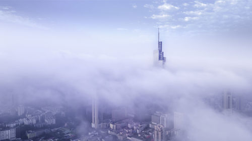 High angle view of buildings in city against sky