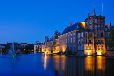 Illuminated buildings in city at night