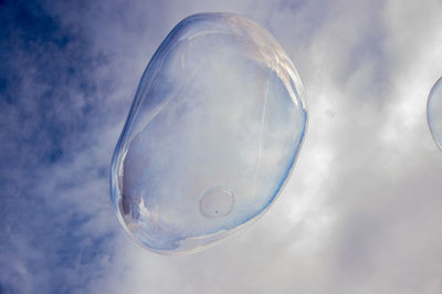 Close-up of bubbles against sky