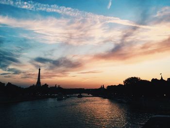 Silhouette of city at sunset
