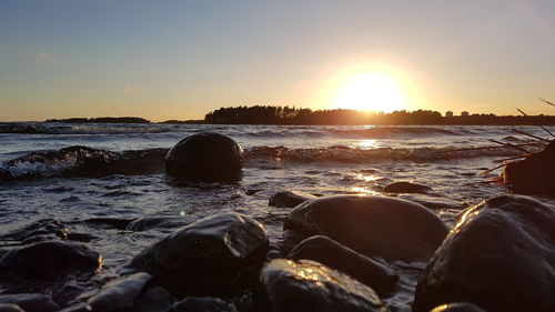 Scenic view of sea against sky during sunset