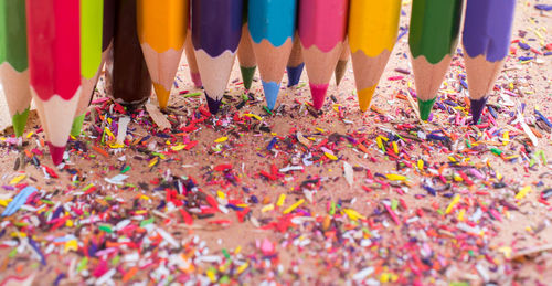 Close-up of various colored pencils on table