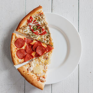 High angle view of pizza in plate on table