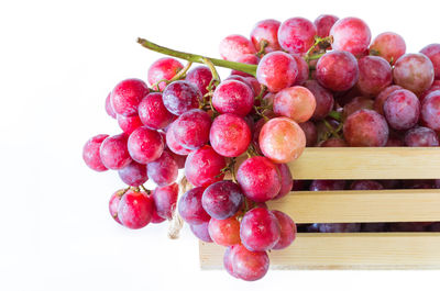 Close-up of grapes against white background