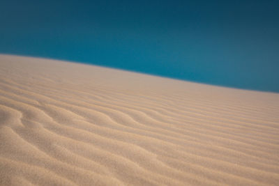 Scenic view of desert against clear sky