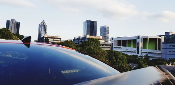 Buildings in city against sky