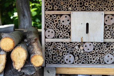 An insect hotel for bees, wasps and other insects made of old wood.