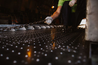 Close-up of man working on display